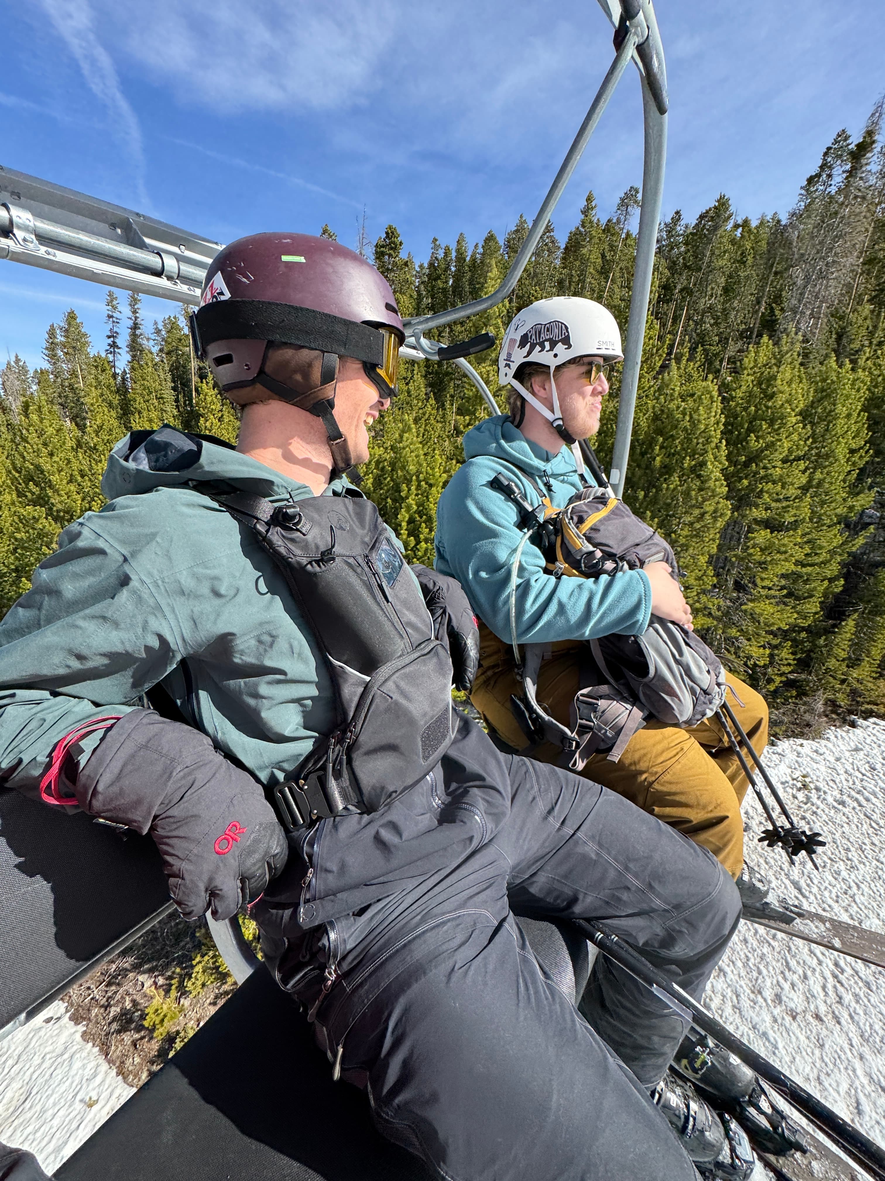 Skier wearing CHAIR1 front-carry pack on mountain