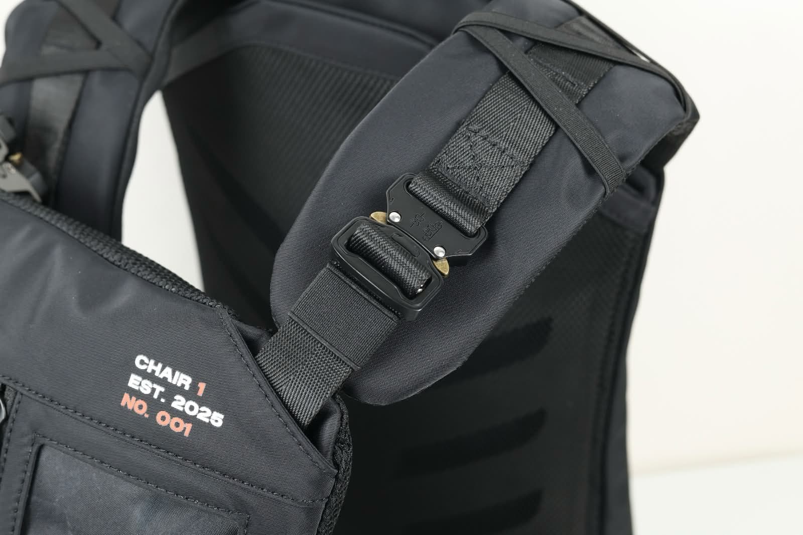 The ski pack's shoulder straps locked in place over a jacket