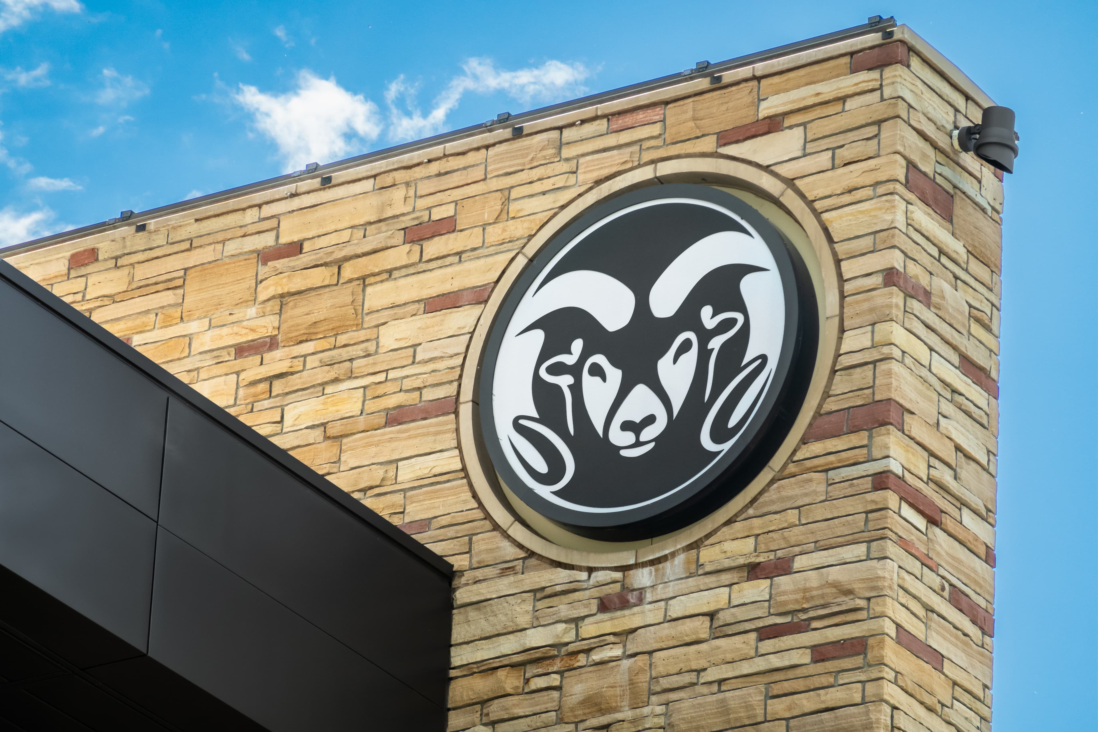 The Colorado State University ram logo on a campus building in Fort Collins