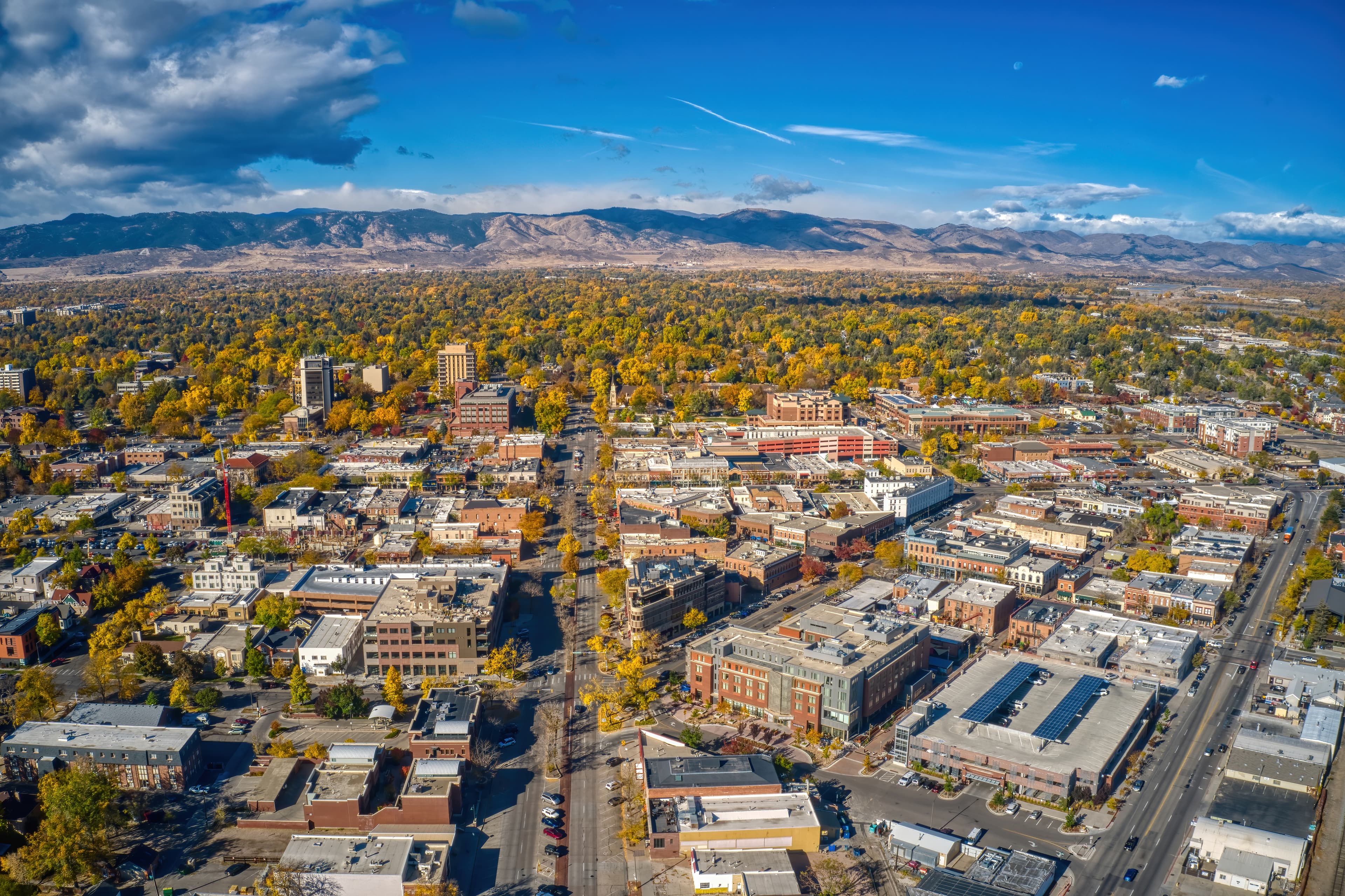 Aerial view of Fort Collins, Colorado, with the Front Range foothills behind downtown