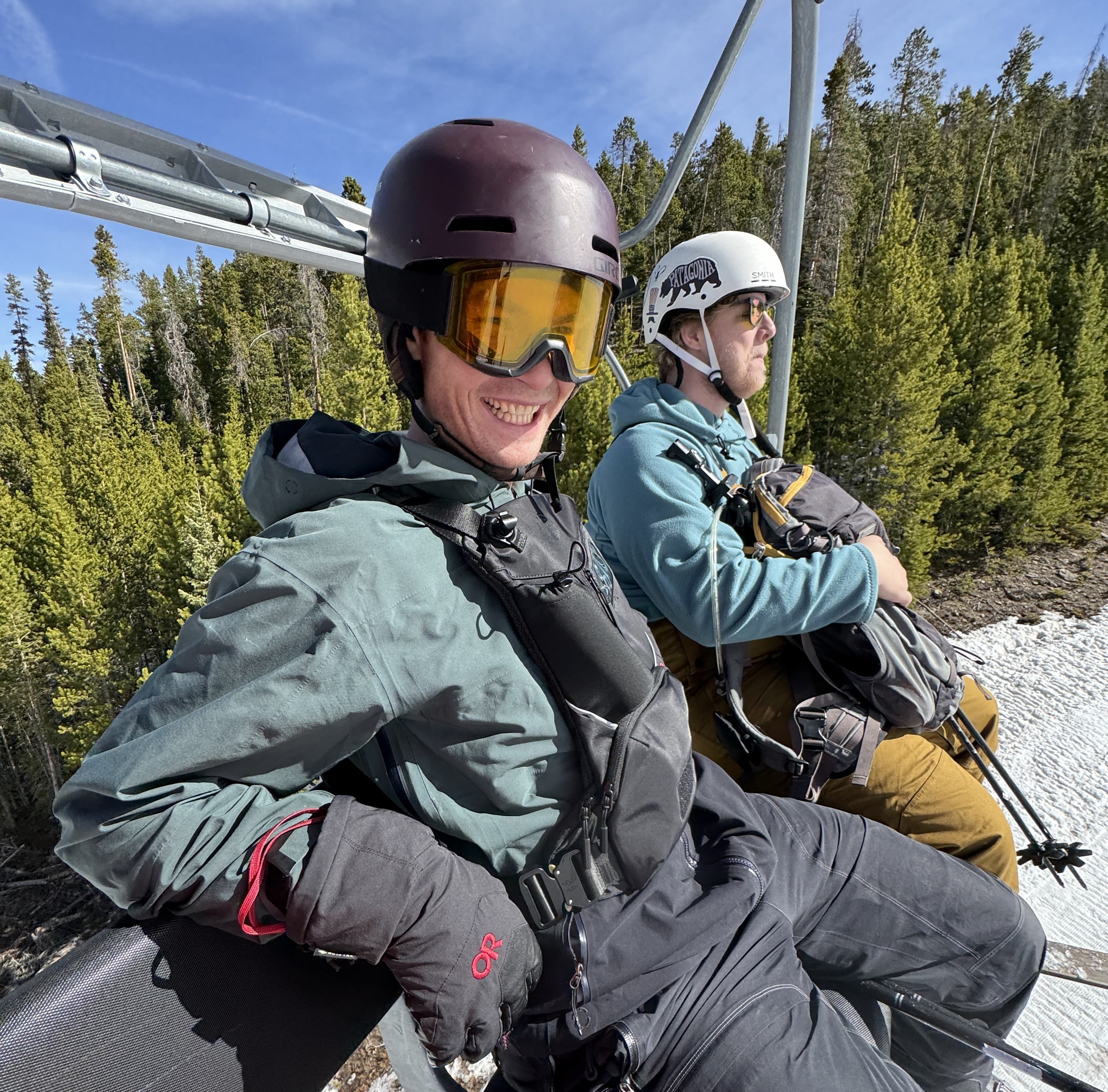 Two riders cheesin' on the chairlift